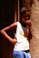 boy leaning against wall