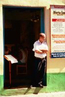 maitre d' leaning against wall