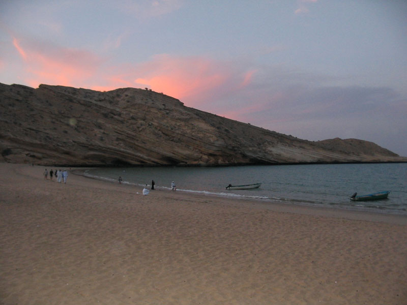 A peaceful beach at sunset,